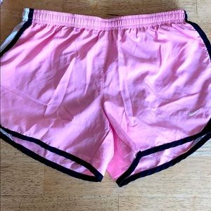 Pink Nike Dri-Fit athletic shorts